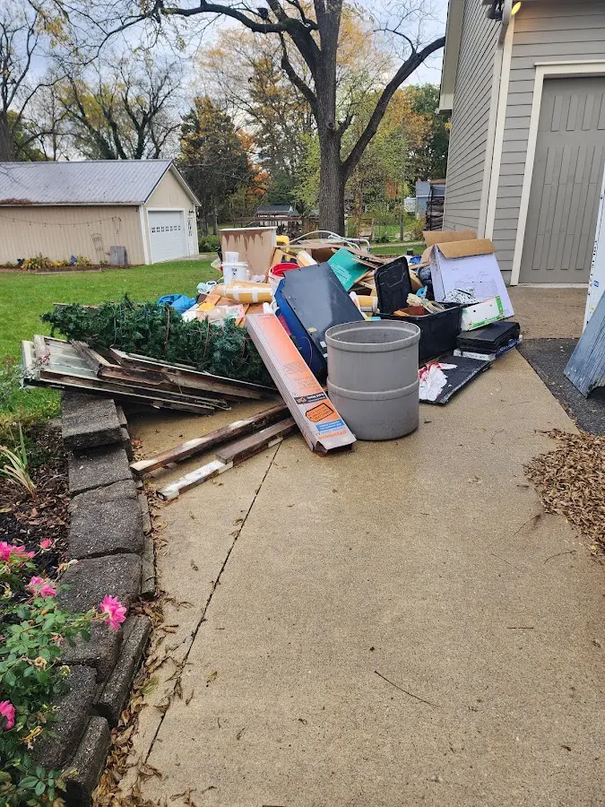 Dumpster being loaded with debris for 10 Yard Dumpster Rental in Kingston